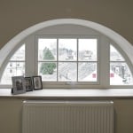 PERFORMANCE triple glazed arched timber window from Green Building Store
