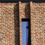 PROGRESSION windows at Meeting House Lane Passivhaus, with corbelled brick reveals to prevent overlooking. Photographer: Paul Samuel White