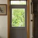 PERFORMANCE triple glazed timber door at The Orchard - Arts and Crafts low energy newbuild - photograph Adam Scott